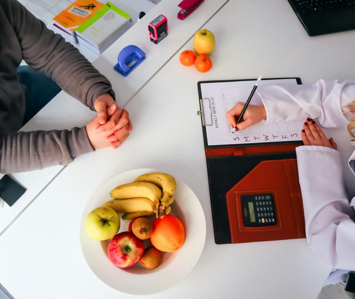 Nutrition specialist creating a personalized meal plan with a patient during a medical weight loss consultation at MD Diet.