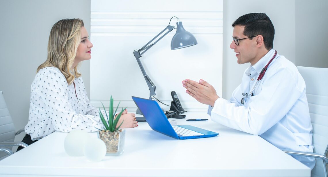 Doctor discussing a personalized medical weight loss plan with a patient during a clinic visit in Salt Lake City.