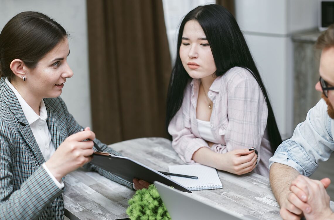 Healthcare provider meeting with patients to discuss a personalized GLP-1 medical weight loss program in a Utah clinic.