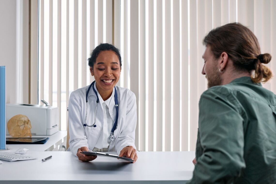 Doctor reviewing a personalized weight loss plan with a patient to overcome a weight loss plateau during a medical consultation.
